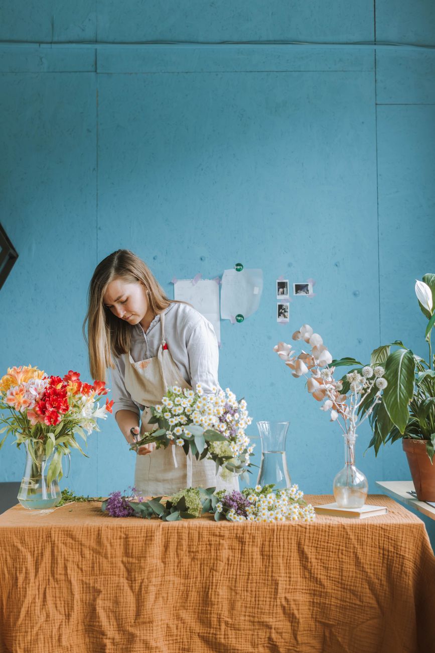 A Fernwood florist arranging at the bench